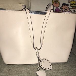 Guess cream colored medium sized tote.